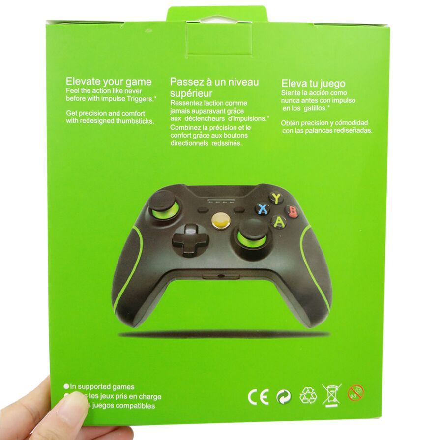 Green packaging of a gaming controller with text on a white background