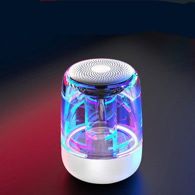 Colorful LED light-up speaker on a dark background