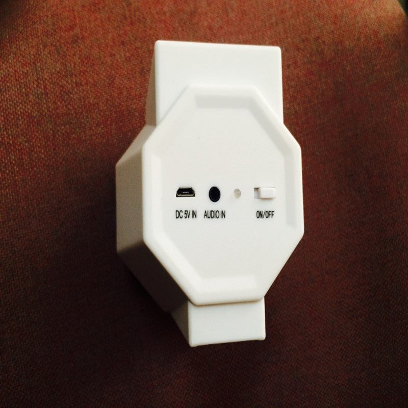 White electronic device with ports on a brown background