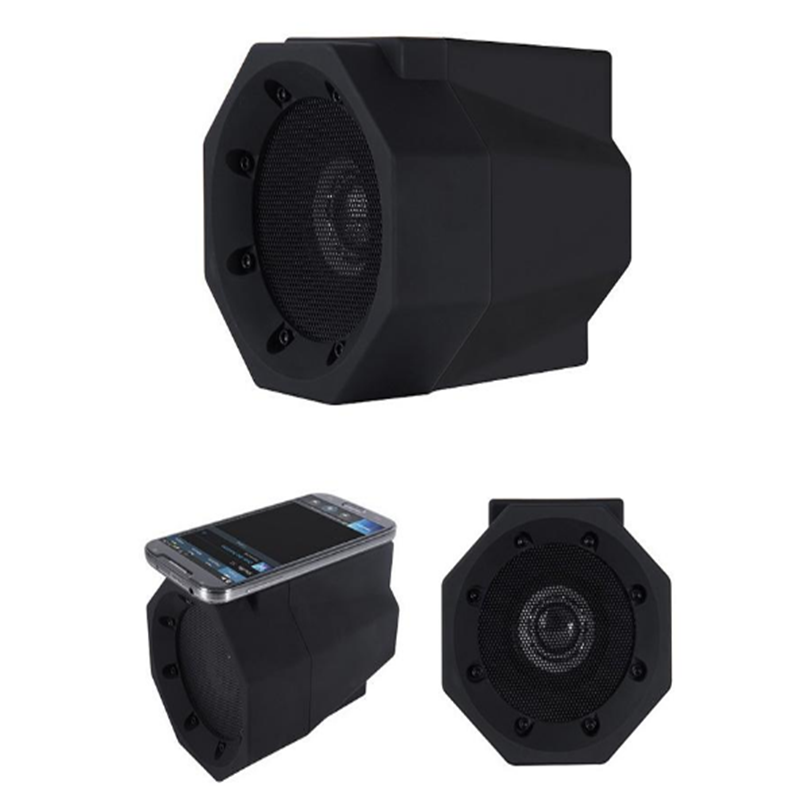 Three black speakers on a white background