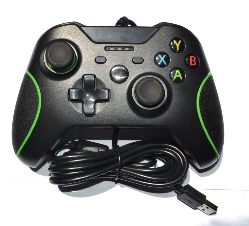Black gaming controller with green accents and USB cable on a white background
