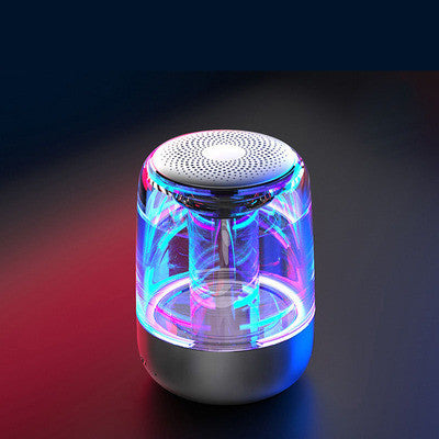 Colorful LED light-up speaker on a dark background