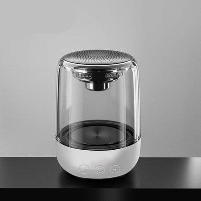 Modern glass container with metallic top on a gray background
