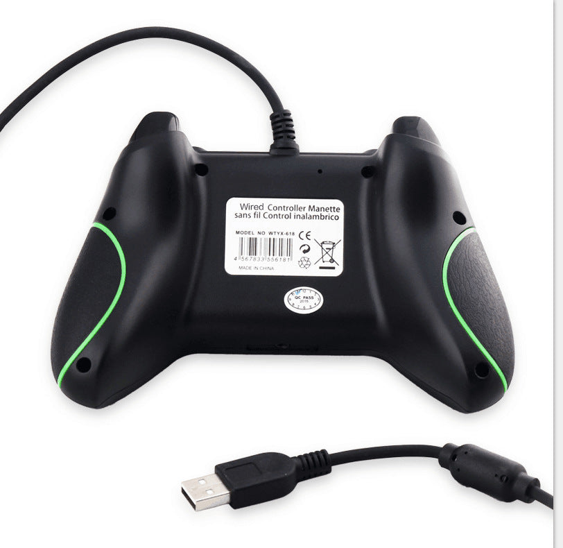 Black gaming controller with green accents and USB cable on a white background