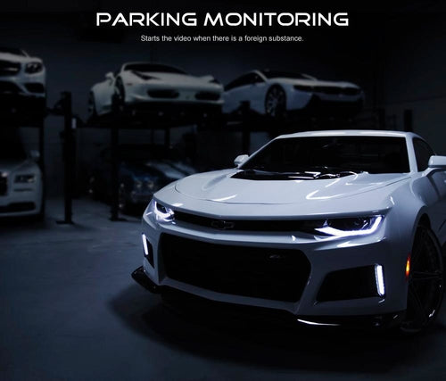 White sports car in a dark setting with 'Parking Monitoring' text above.