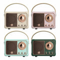 Four vintage-style radios in different colors on a white background