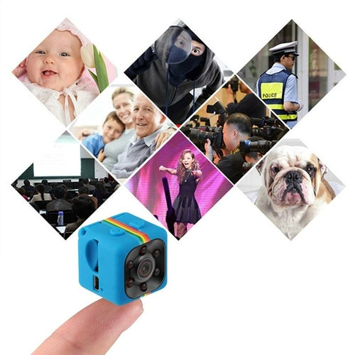 Small blue camera with various scenes including a baby, family, police officer, and dog on a white background.